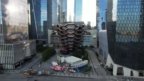 An-aerial-view-of-the-Vessel,-known-as-the-Hudson-Yards-Staircase-on-a-sunny-day