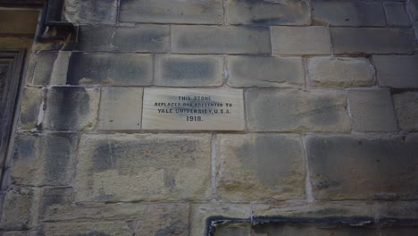 Yale-University-Stone-on-the-exterior-wall-of-St-Giles-Parish-Church,-Wrexham,-Wales