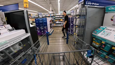 POV-while-pushing-a-cart-through-Walmart-in-electronics-section