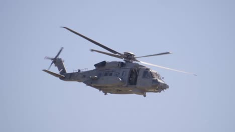 Slow-Motion-Military-Helicopter-Flying-with-Open-Cargo-Door,-Close-Up