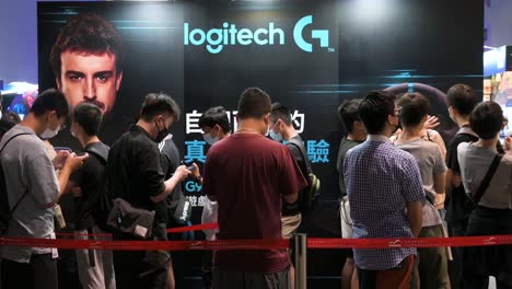 Chinese-visitors-queue-in-line-to-access-the-Logitech-brand-booth-during-the-Hong-Kong-Computer-and-Communications-Festival-in-Hong-Kong