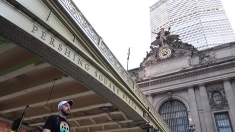 Slow-motion-Grand-Central-sign-people-walking-by