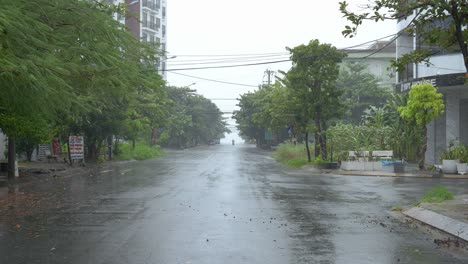 Strong-Wind-and-Heavy-Rain-on-Street-in-Da-Nang-City-Residential-Neighborhood,-Vietnam-Just-Before-Noru-Typhoon