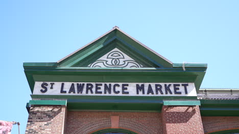 Pan-across-St-Lawrence-Market-building-sign,-Toronto