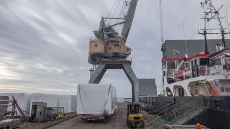 Harbor-Crane-Loading-Cargo-Vessel-At-Port-Operating-Company-In-Liepāja,-Latvia