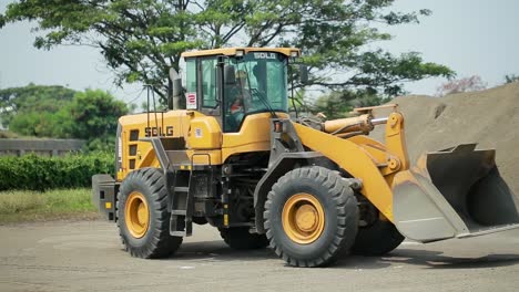 Big-yellow-front-end-loader-or-all-wheel-bulldozer