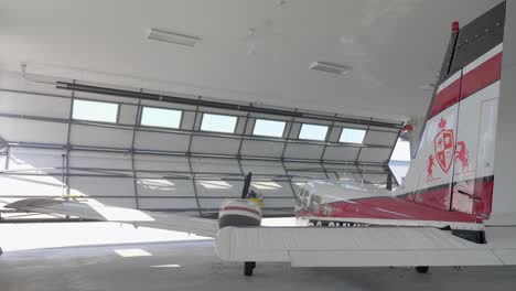 Airplane-in-Airport-Hangar-with-Opening-Folding-Doors,-Static