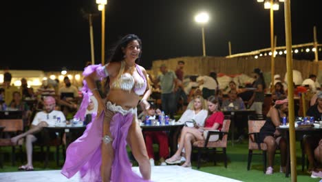 Exotic-belly-dancer-with-long-black-hair-dances-on-stage-in-Dubai,-UAE