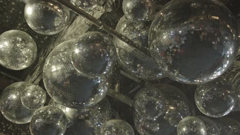 Close-Up-Shot-Of-Suspended-Silver-Mirror-Disco-Balls