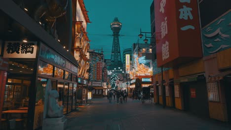 Cinematic-shot-of-the-famous-Tsutenkaku-tower-in-Osaka-during-the-evening