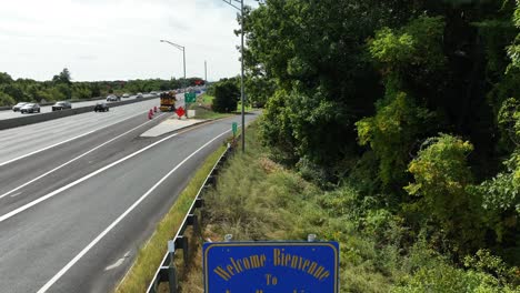 State-border-of-New-Hampshire-along-busy-highway