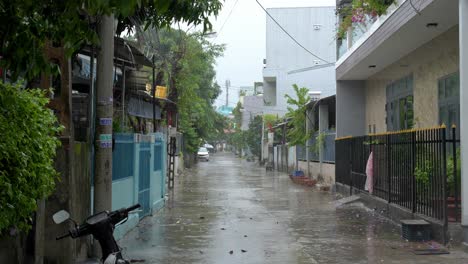 Heavy-Tropical-Rain-Before-Incoming-Typhoon-and-Flooding-on-Street-in-Residential-Neighborhood-of-Da-Nang,-Vietnam