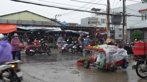 Monsoon-Season-and-Incoming-Rainstorm-in-Vietnam,-People-in-Front-of-Traditional-Market
