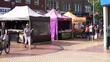 Chelmsford-City-local-market-in-the-high-street-with-people-walking-by