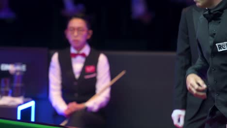 English-snooker-player-Ronnie-O'Sullivan,-World-Champion-and-World-Number-One,-strikes-a-ball-at-a-match-again-female-snooker-player-Ng-On-Yee-during-the-Hong-Kong-Masters-snooker-tournament-event