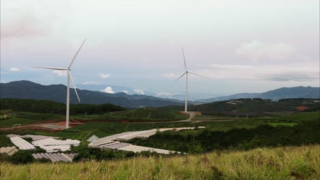 Handheld-shot-of-Wind-turbine-farm-in-Dalat,-a-dreamy-mountain-town-in-Vietnam-famous-for-its-agriculture