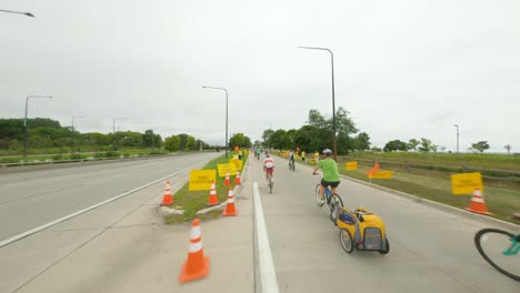 Chicago-cyclists-riding-northbound-on-DuSable-Lake-Shore-Drive-during-Bike-the-Drive-2022-red-triathlon-triathlete-time-trial-bike-south-side-off-ramp-detour