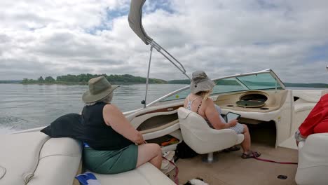 Slow-motion-of-passengers-in-cockpit-of-a-sports-boat-cruising-on-Table-Rock-Lake