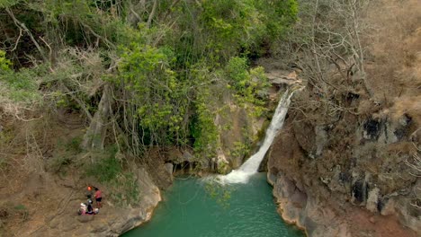 People-Swimming-And-Relaxing-At-The-Cascada-de-Comala-Park-With-Impressive-Waterfall-In-Jalisco,-Mexico