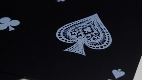 Macro-view-of-the-ace-of-spades-of-a-black-deck-of-cards