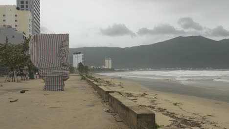Strong-Wind-and-Rough-Sea-on-Dark-Day,-Incoming-Tropical-Storm-on-Coast-of-Da-Nang-City,-Vietnam