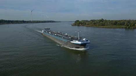 Aerial-View-Of-Starboard-Side-Of-Comus-2-Inland-Tanker-Along-Oude-Maas-With-Windmills-In-Background
