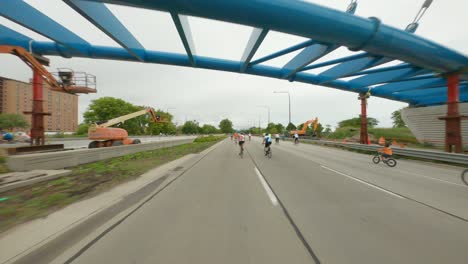 Chicago-cyclists-riding-northbound-on-DuSable-Lake-Shore-Drive-during-Bike-the-Drive-2022-blue-pedestrian-bridge-under-construction
