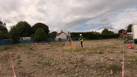 Surveyor,-Site-Engineer-doing-survey-with-Leica-total-station-on-construction-site-prior-works