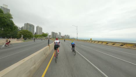 Chicago-cyclists-riding-northbound-on-DuSable-Lake-Shore-Drive-during-Bike-the-Drive-2022-red-athlete-oak-street-beach-area-north-side