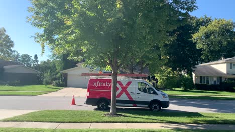 Comcast-van-parked-near-a-tree-in-a-neighborhood-on-a-sunny-day