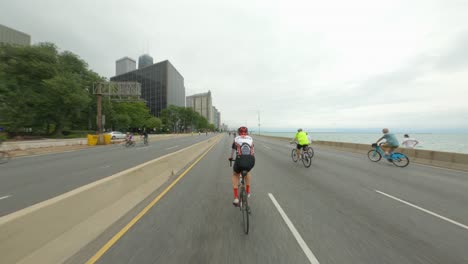 Chicago-cyclists-riding-northbound-on-DuSable-Lake-Shore-Drive-during-Bike-the-Drive-2022-john-hancock-building-in-the-background-north-side