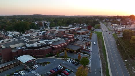 Aerial-drone-shot-of-large-hospital-building-at-dawn