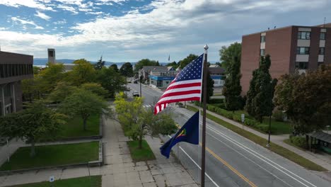 USA-and-Vermont-State-flag-waving-in-breeze