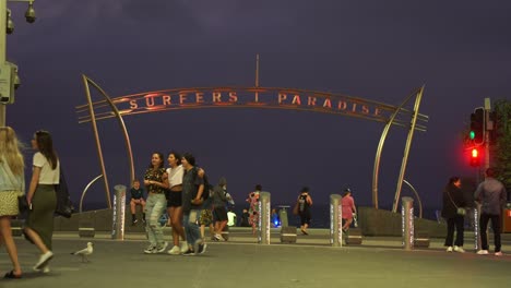 People-strolling-and-walking-around-the-esplanade-on-a-chill-summer-night-at-iconic-landmark-of-surfers-paradise,-Gold-Coast,-Australia