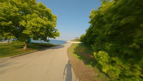 Time-lapse-of-southbound-bike-ride-on-Chicago's-Lakefront-Trail-bike,-running,-and-walking-path-on-the-shores-of-Lake-Michigan-loop-to-planetarium-museum-campus