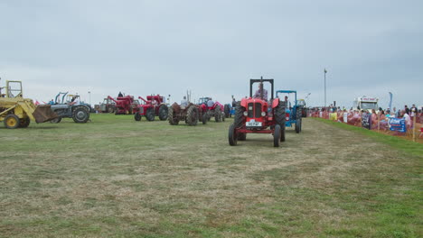 Timelapse-Of-Antique-Tractors-At-The-Showring-During-Exhibition-At-Great-Trethew-Vintage-Rally-In-Liskeard,-UK