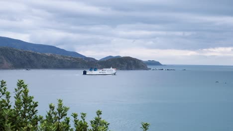 Interislander-ferry-near-Pencarrow-lighthouse,-leaving-Wellington-harbour,-traveling-to-coastal-town-of-Picton,-South-Island-of-New-Zealand-Aotearoa