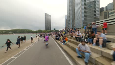 Biking-on-the-Lakefront-Trail-through-crowds-watching-The-2022-Chicago-Air-and-Water-Show-on-the-shores-of-Lake-Michigan