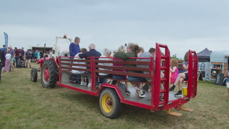 English-People-On-A-Tractor-drawn-Wagon-Ride-At-The-Great-Trethew-Vintage-Rally-In-Liskeard,-UK