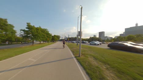 Time-lapse-of-southbound-bike-ride-on-Chicago's-Lakefront-Trail-bike,-running,-and-walking-path-on-the-shores-of-Lake-Michigan-loop-downtown-skyline-skyscrapers