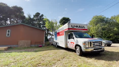 Large-U-Haul-truck-parked-by-a-house