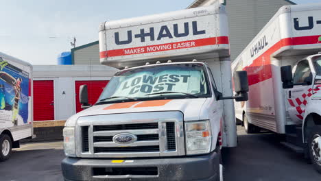 Large-U-Haul-Truck-with-Lowest-Cost-sign-in-window