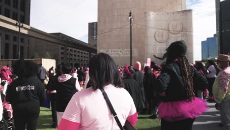 Cancer-awareness-event-in-downtown-Detroit,-Michigan-with-gimbal-video-walking-forward