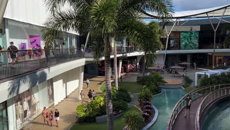 Family-and-shoppers-shopping-at-pacific-fairs-shopping-centre-at-Broadbeach-Waters,-Gold-Coast-on-a-relaxing-and-sunny-afternoon,-Queensland,-Australia