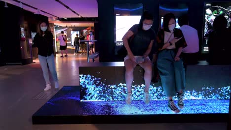 Chinese-visitors-interact-with-a-digital-art-installation-at-the-Digital-Art-Fair-showcasing-upcoming-trends-such-as-Web-3