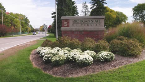 Michigan-State-University-in-East-Lansing,-Michigan-sign-with-stable-establishing-shot-video