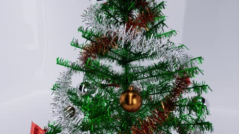 Christmas-tree-with-gold-and-silver-balls,-ornaments,-and-a-glowing-star,-on-white-glossy-background