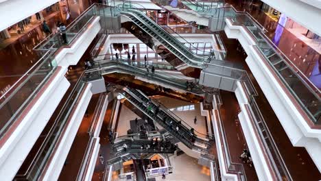 Bird's-eye-view-using-an-iPhone-13-Pro-Max-smartphone-of-Chinese-citizens-and-shoppers-enjoying-their-evening-at-a-retail-shopping-mall-in-Hong-Kong