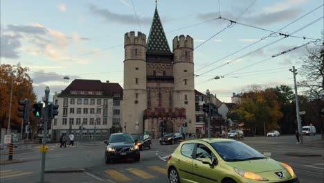 Spalentor-city-gate-of-Basel-front-view-with-car-and-bike-traffic