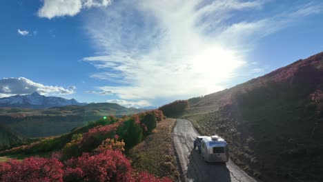 A-perfect-looking-fall-afternoon-adventuring-a-backroad-during-the-fall-season-in-Colorado-in-a-travel-trailer